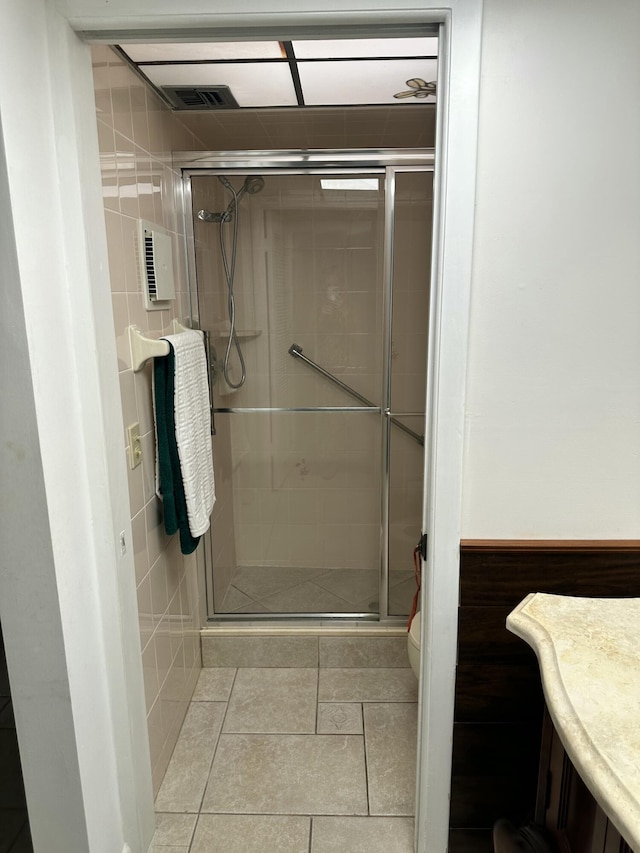 bathroom featuring walk in shower and toilet