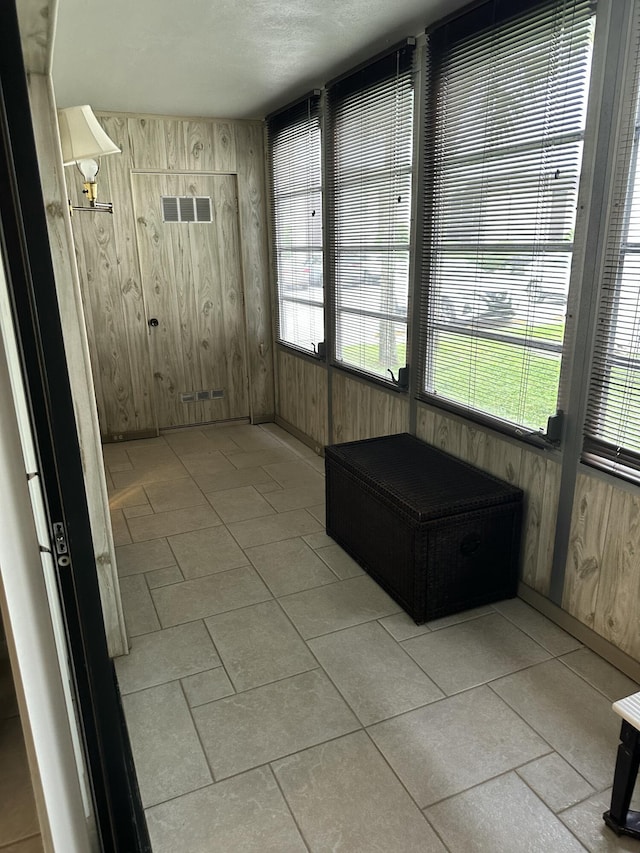 unfurnished sunroom featuring a healthy amount of sunlight