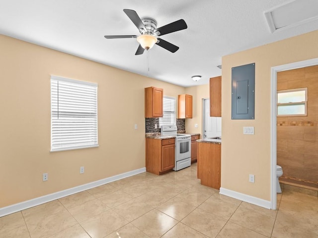 kitchen with light stone countertops, ceiling fan, white electric stove, electric panel, and light tile patterned floors