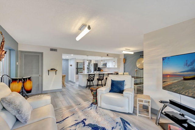 living room featuring light wood-type flooring