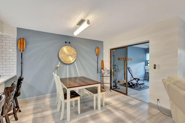 dining area with light hardwood / wood-style floors