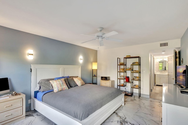 bedroom featuring ensuite bathroom and ceiling fan