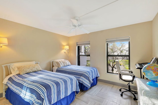 bedroom featuring light parquet flooring and ceiling fan