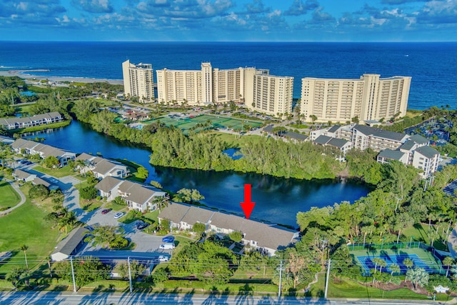 birds eye view of property featuring a water view