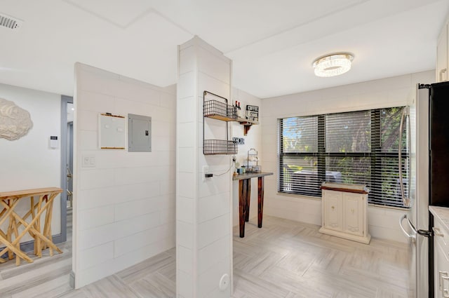 bathroom with electric panel and parquet floors