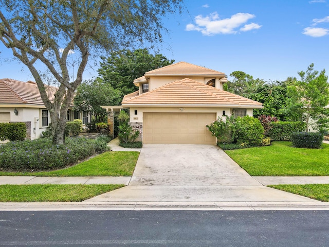 view of front of property featuring a garage and a front yard