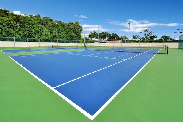 view of sport court featuring basketball hoop