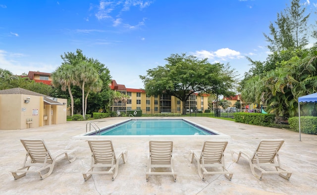 view of swimming pool featuring a patio