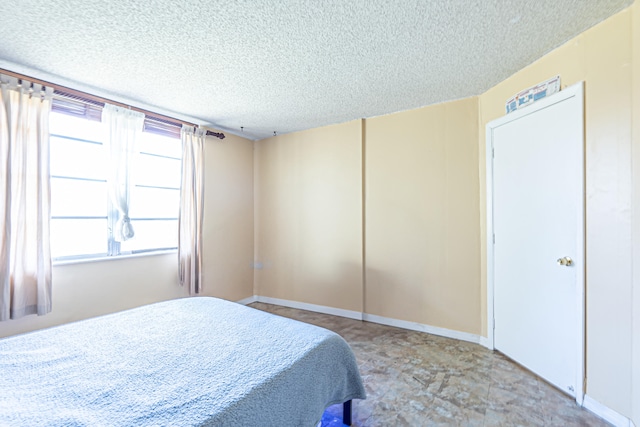 bedroom with a textured ceiling