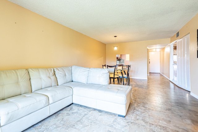 living room featuring a textured ceiling