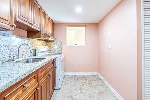 kitchen with light stone countertops, tasteful backsplash, white electric stove, and sink