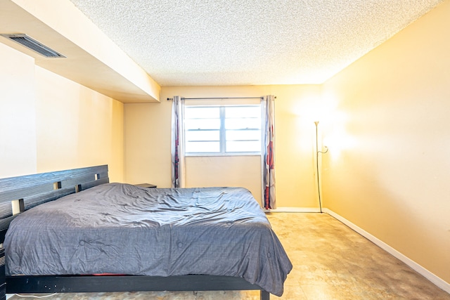 bedroom featuring a textured ceiling