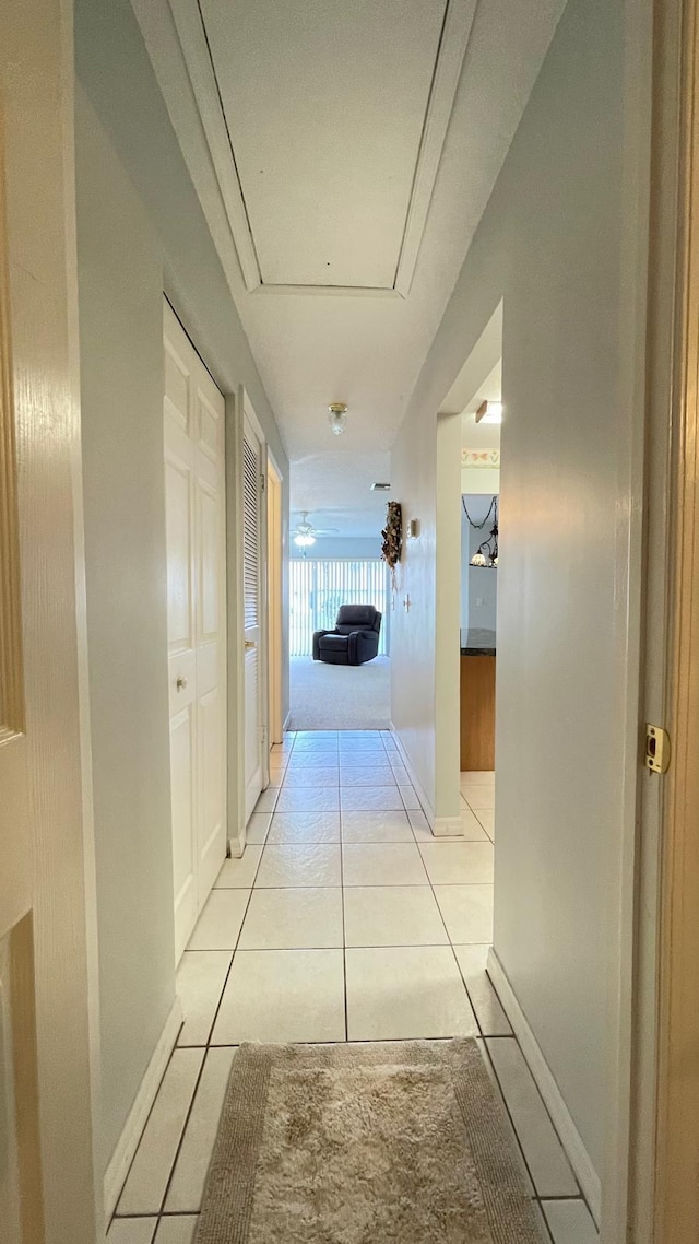 hall with light tile patterned flooring