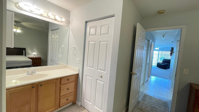 bathroom featuring ceiling fan, tile patterned flooring, and vanity