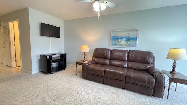 living room with carpet and ceiling fan