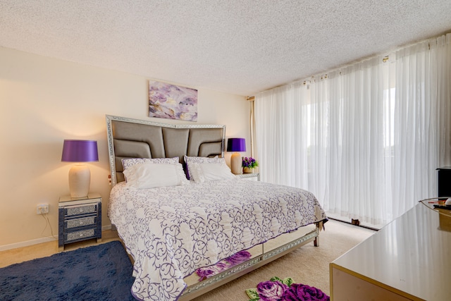 carpeted bedroom featuring a textured ceiling