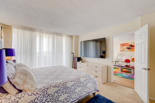 carpeted bedroom with a textured ceiling