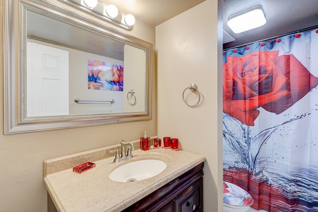 bathroom with a shower with curtain and vanity