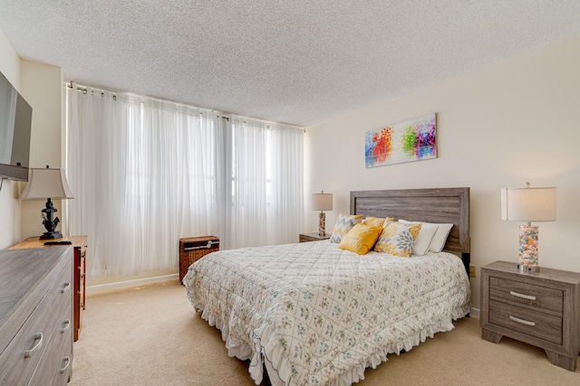 carpeted bedroom with a textured ceiling