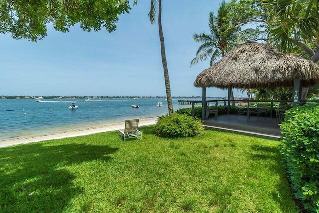 water view featuring a gazebo and a beach view