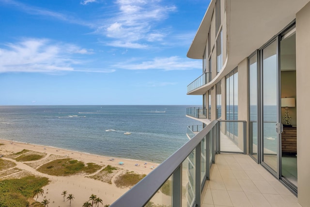 exterior space featuring a view of the beach and a water view