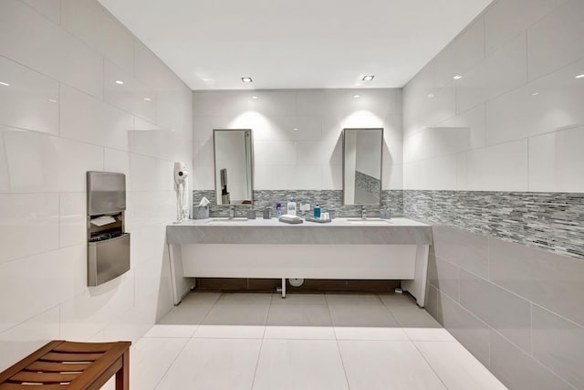 bathroom with tile patterned floors, decorative backsplash, tile walls, and vanity