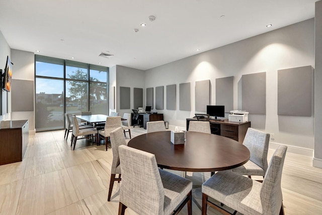 dining area with a wall of windows