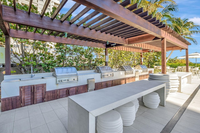 view of patio / terrace with a pergola, area for grilling, and grilling area