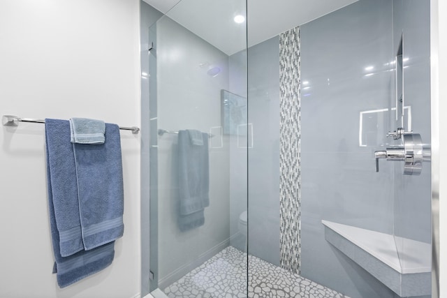 bathroom featuring tile patterned flooring and an enclosed shower