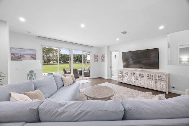 living room with dark hardwood / wood-style floors