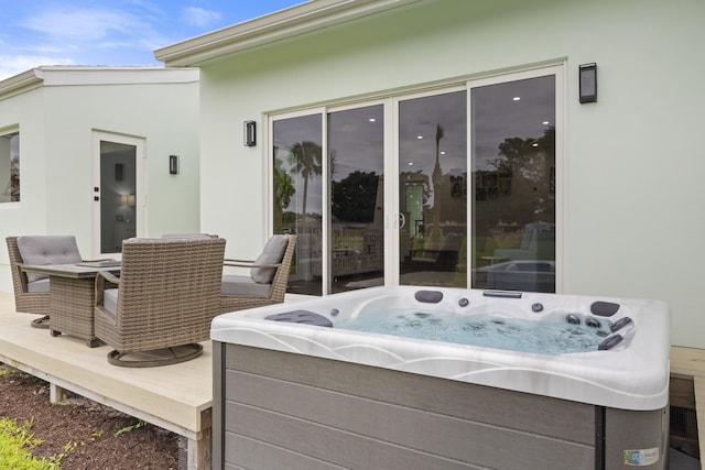 view of patio / terrace with a hot tub