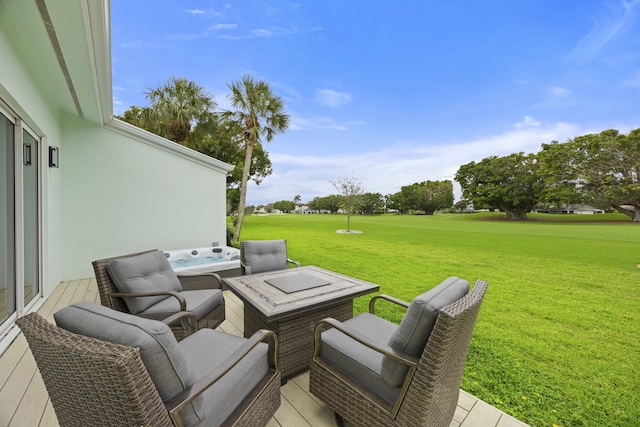 view of patio / terrace with a hot tub