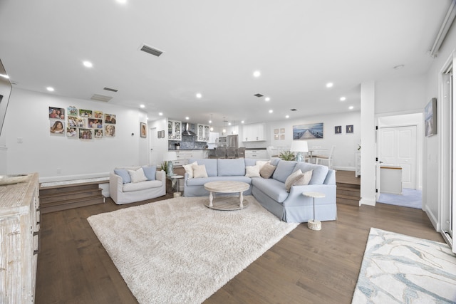 living room featuring dark wood-type flooring