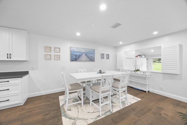 dining space featuring dark hardwood / wood-style flooring