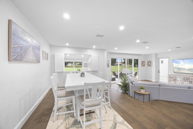 dining room with hardwood / wood-style flooring