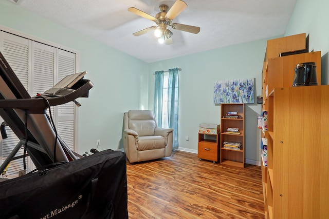 interior space with wood-type flooring and ceiling fan