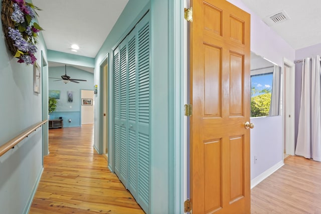 hallway with light wood-type flooring