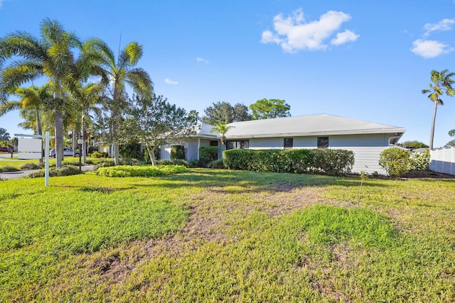 single story home featuring a front yard