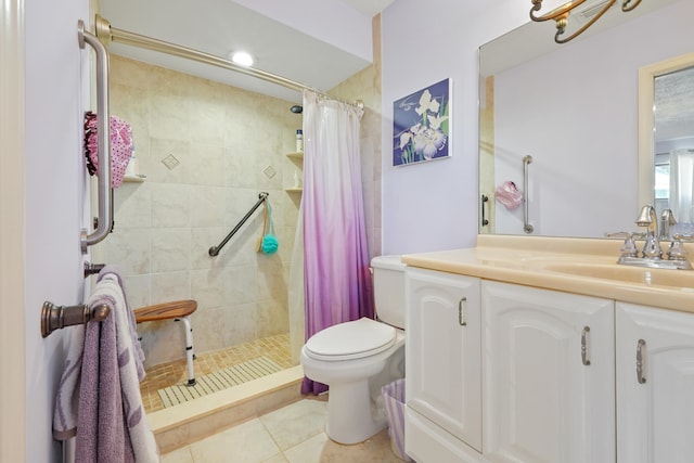 bathroom with tile patterned floors, vanity, toilet, and curtained shower