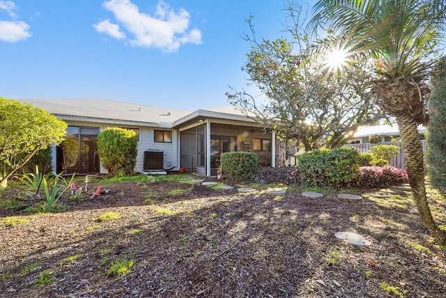 view of front of property with cooling unit and a sunroom