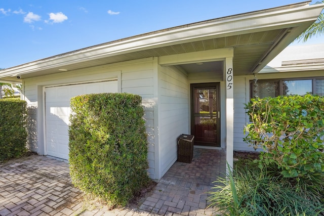 doorway to property featuring a garage