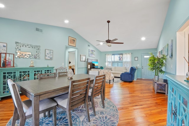 dining room featuring ceiling fan, lofted ceiling, and light hardwood / wood-style floors