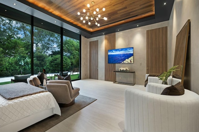 bedroom with an inviting chandelier, hardwood / wood-style flooring, a towering ceiling, a wall of windows, and wood ceiling