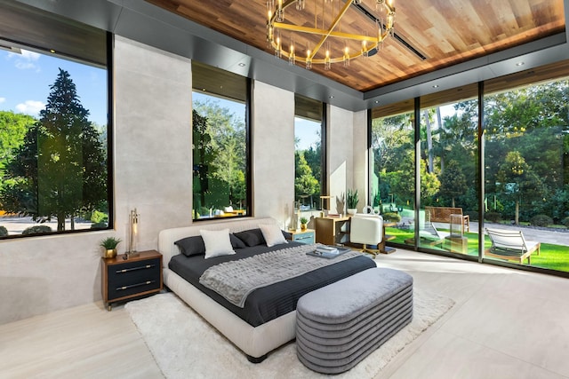 sunroom featuring a chandelier and wood ceiling