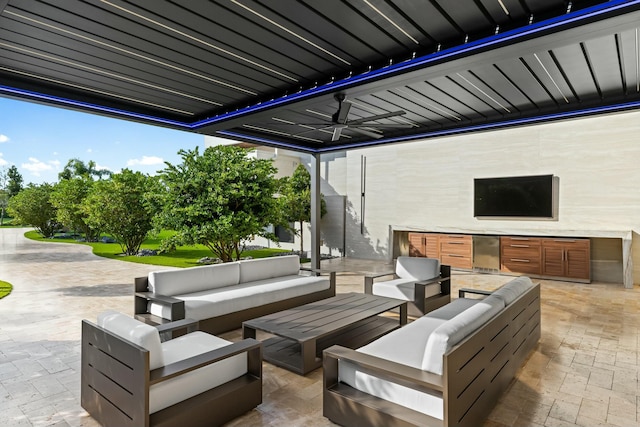 view of patio featuring outdoor lounge area, area for grilling, and ceiling fan