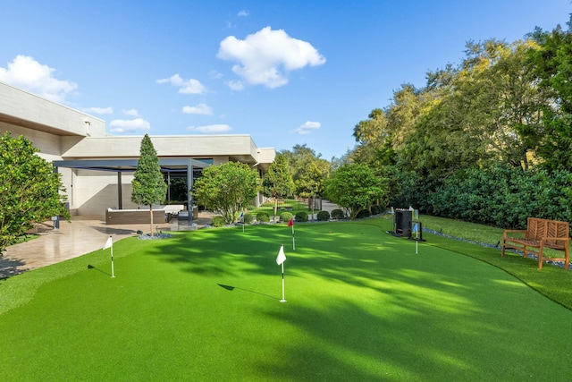 view of property's community with a patio