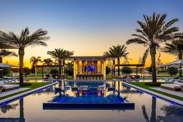 view of pool featuring a patio area and a bar