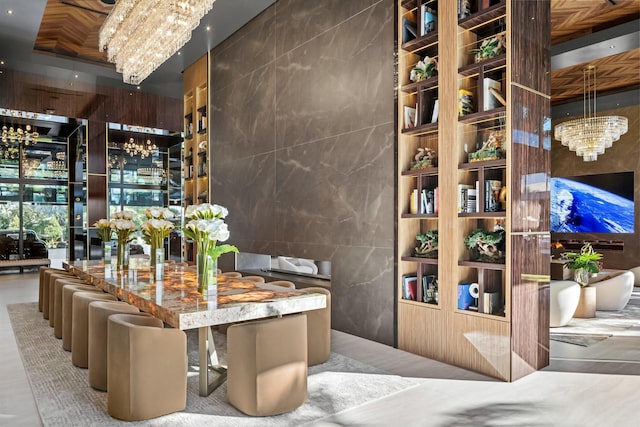 wine room with tile walls and a chandelier