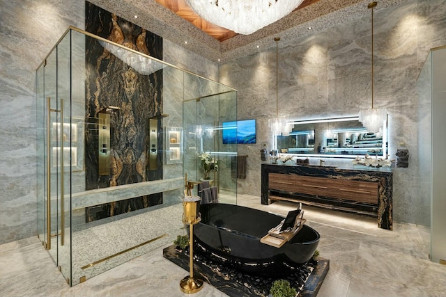 bathroom featuring vanity and a towering ceiling