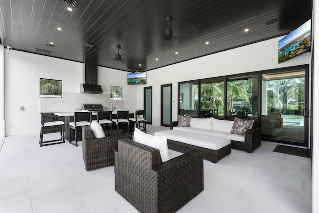 view of patio / terrace with an outdoor living space and an outdoor kitchen